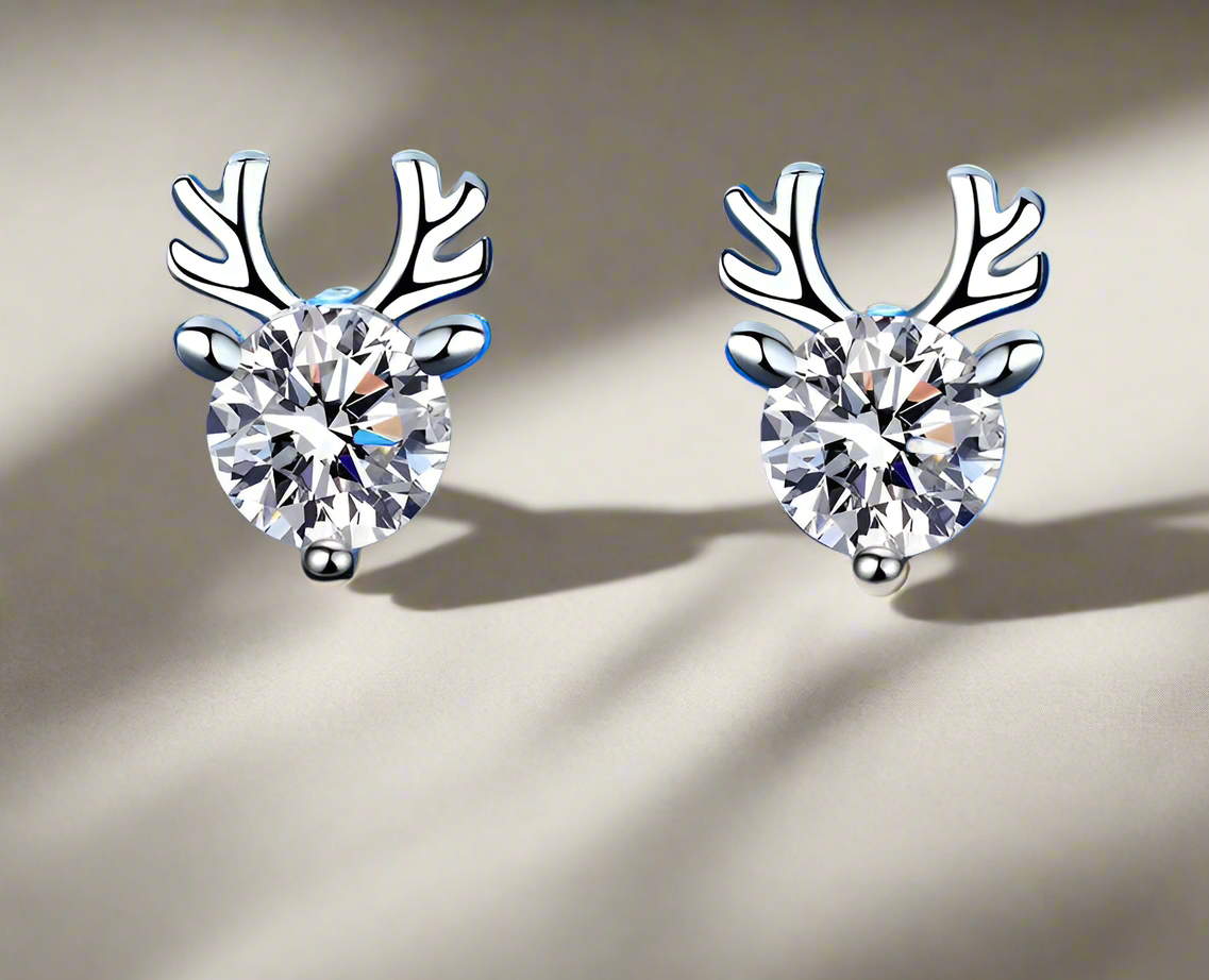 A pair of 925 sterling silver stud earrings featuring a reindeer design with a central cubic zirconia.