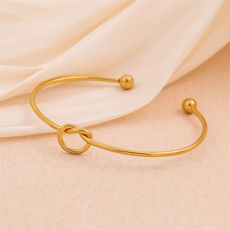 Minimalist gold plated stainless steel knot bangle bracelet