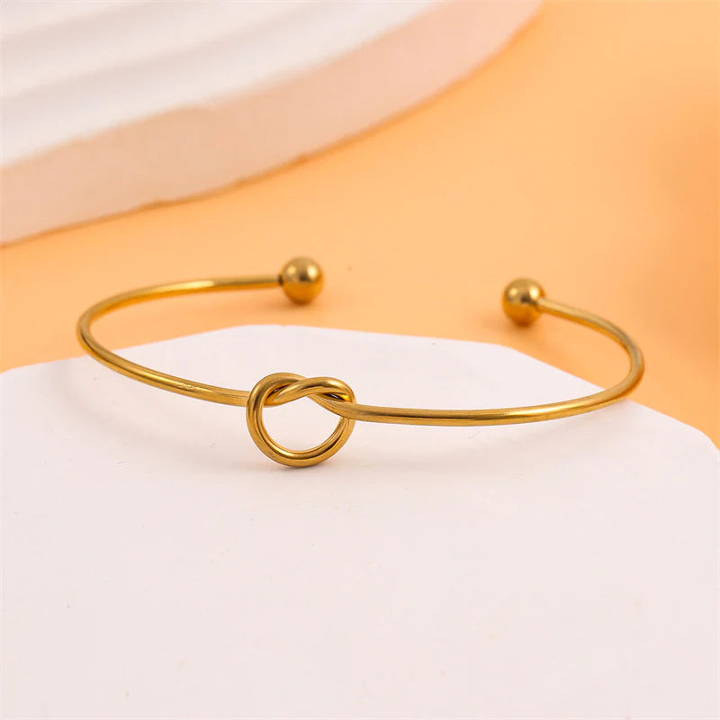 Minimalist gold plated stainless steel knot bangle bracelet